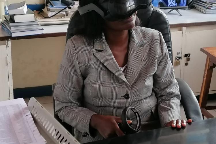 DIRM Chairman Dr. C. Onyambu testing the Virtual Reality (VR) goggles.